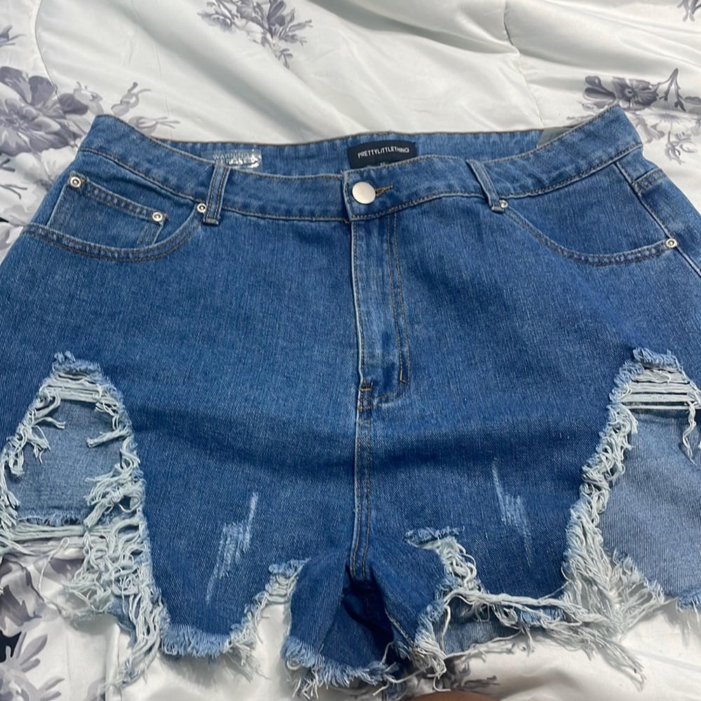 extreme thigh rip shorts.